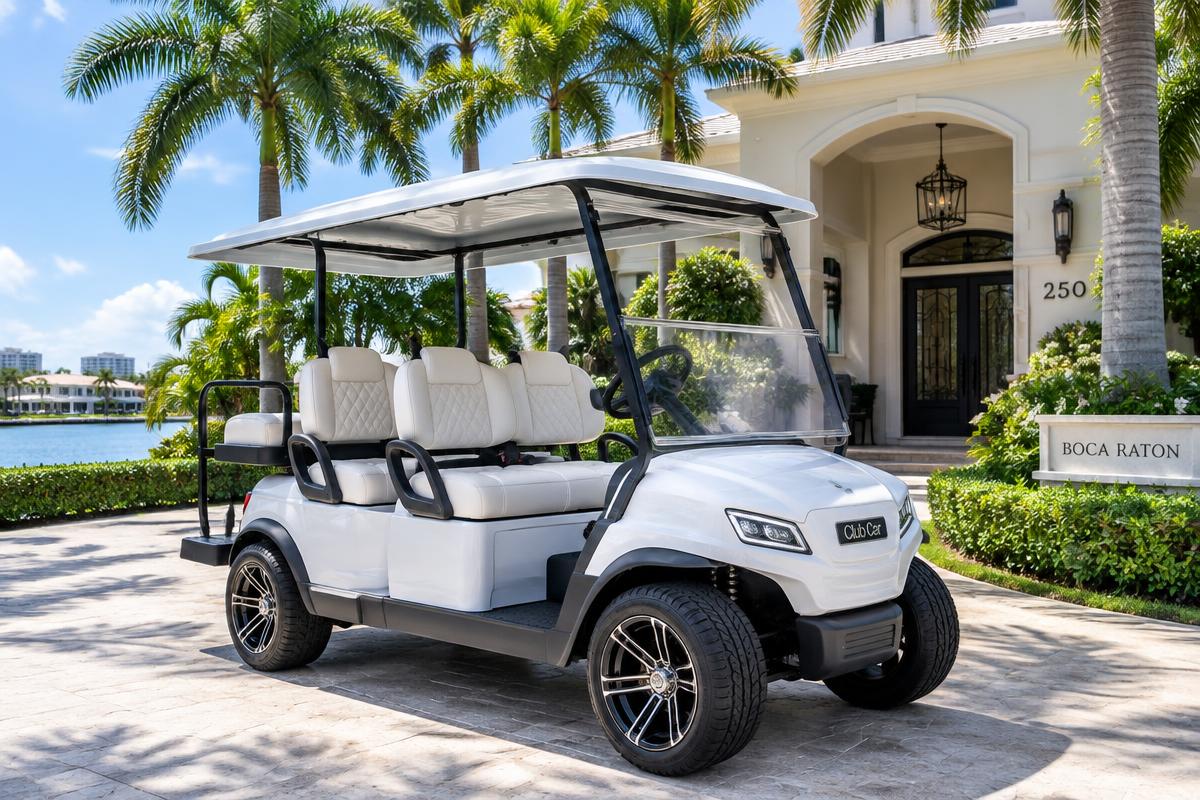 White golf cart ready for use at a Boca Raton home